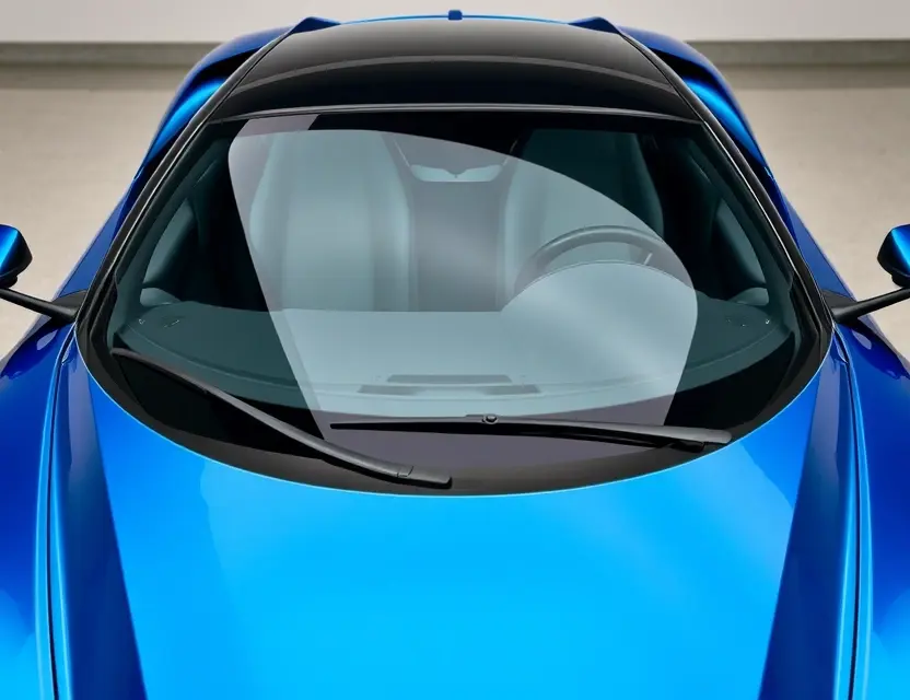 A high-quality image depicting a Mazzanti car with a replaced windshield. The windshield is clear and new, seamlessly integrated with the car's design. Focus on the sleek lines of the car and the clarity of the replacement glass.